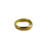 A 22ct gold wedding band, of thick design with engraving 'to my wife 29th June 1957,' ring size U,