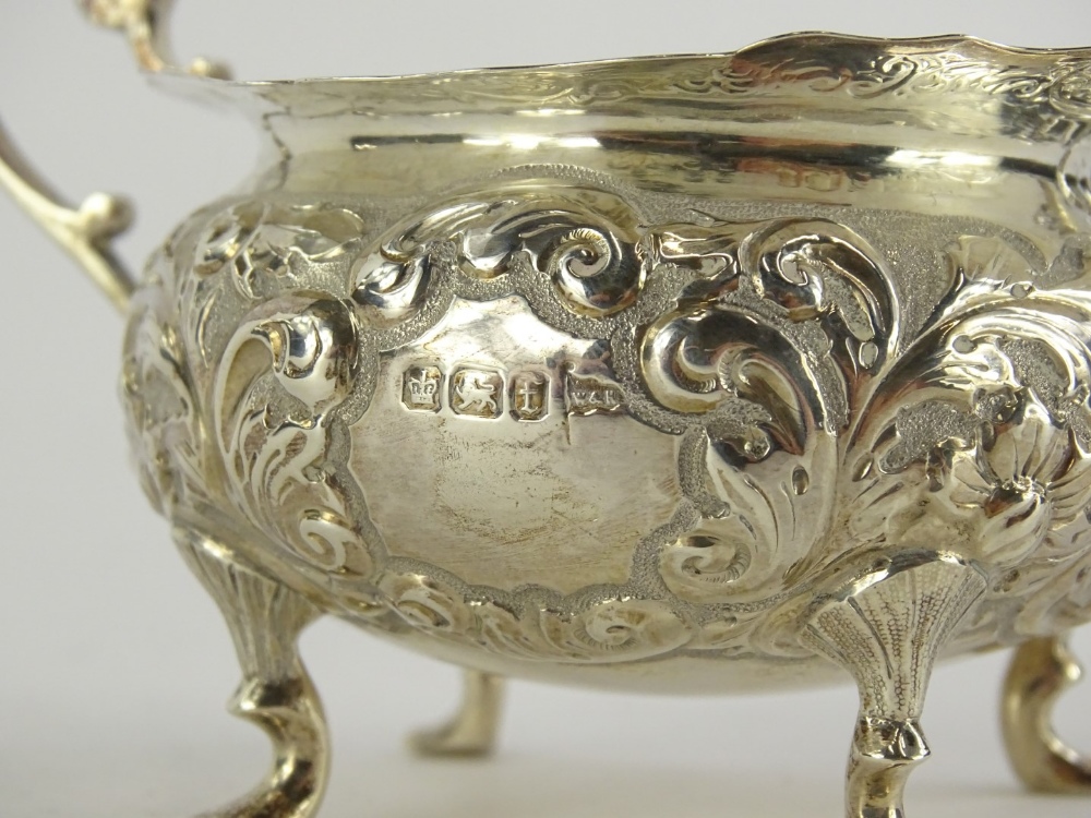 A George V silver cream boat by Walker & Hall, of compressed circular form, repousse decorated - Image 2 of 2