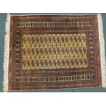 An Afghan Turkomen rug, with a design of three rows of 15 medallions on a beige ground, with