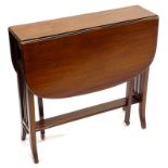 An Edwardian walnut Sutherland table, the rounded top with rectangular corners on slatted end