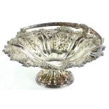 An Edwardian silver plated comport, of shaped form, repousse decorated with berries and scrolls,