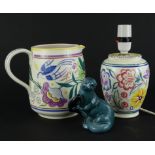 Three items of Poole pottery, a large jug decorated with flowers, birds in typical manner, printed