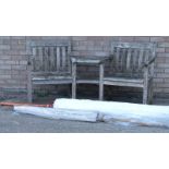 A slatted teak double garden seat or bench, with two tier table and parasol.