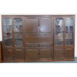 A large oriental hardwood side cabinet, in three parts with panelled doors, a fall front section and
