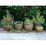 An associated set of four Chinese stoneware jardinieres, each decorated with dragons, birds etc.,