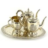 A five piece white metal tea and coffee service, the coffee pot 22cm high, water jug, milk jug and