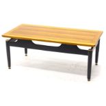 A G Plan teak and ebonised coffee table, with brassed mounts, 99cm wide.