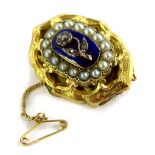 A Victorian memorial brooch, the front with three layer design, with central blue enamel panel, with