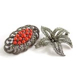 Two silver and marcasite set brooches, comprising a silver flower design brooch set with various