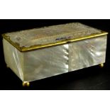 A late 19thC continental mother of pearl jewellery box, with gilt metal mounts, engraved with