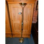 A brass uplighter with reading lamp attachment, 180cm high.