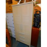 A birch effect two door wardrobe, with three drawers below, 185cm high, 80cm wide, 52cm deep.