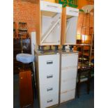 A pair of white painted kitchen units, 40cm and 30cm wide, respectively., together with two four