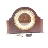 A Smiths oak cased mantel clock, with eight day movement, with key, 21cm high, 30cm wide.