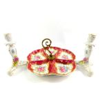 A Porcelain De France hors d'oeuvres dish, with central brass handle, decorated with flowers on a