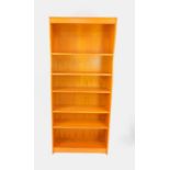 A teak open bookcase, of six shelves, raised on a plinth base, 207cm high, 90cm wide, 32.5cm deep.