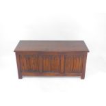 A Continental oak linenfold panelled blanked chest, raised on square legs, 53.5cm high, 114cm