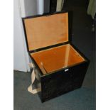 A black painted plywood fishing box, with a canvas strap, 46cm high, 51cm wide, 36cm deep.