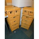 A pair of softwood chests with wicker drawers, each 81cm high, 34cm wide, 24cm deep.