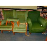 Two wingback armchairs, upholstered in green draylon, with a matching stool, together with an