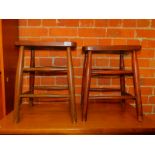 A pair of 19thC laboratory stools. (2)