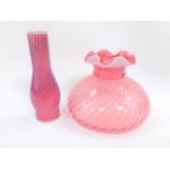 A Victorian cranberry and opaline glass oil lamp shade, with associated chimney, shade 27cm