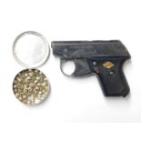 A Perfecta starting pistol, together with a tin of blank cartridges . (2)