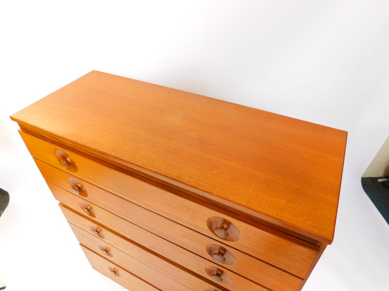 A Meredew teak chest, of seven long graduated drawers, raised on a plinth base, 113cm high, 102cm - Image 2 of 3