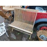 A teak slatted folding garden bench.