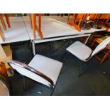 A 1970's/80's extending kitchen table, with white melamine top, raised on chrome legs, 76cm high,