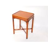 A reproduction mahogany night stand, with galleried top and a pierced X frame stretcher, 66cm