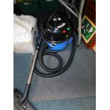 A Numatic International Henry Micro vacuum cleaner, with hose and attachment.