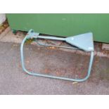 A tubular steel shooting seat.