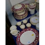 A Burleigh Tudor pottery part dinner and coffee service, decorated in red and grey with vines. (2