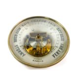 An early 20thC brass cased circular aneroid barometer, 20.5cm diameter.