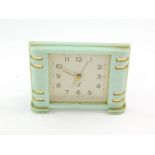 A Jaz French early 20thC marbled green Bakelite cased bedside clock.