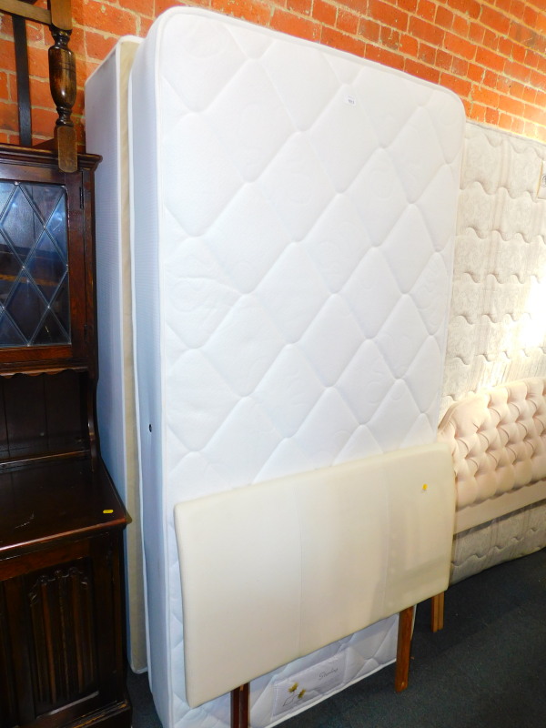 A single divan bed base, with a Sterling mattress and headboard. (3)