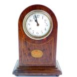 An American early 20thC mahogany and inland mantel clock, 15cm high, 10.5cm wide.