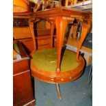 A reproduction mahogany drum coffee table, with green leather insert, 55cm high, 87cm diameter,