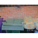 An Oldrid & Co two seater sofa, upholstered in green fabric, together with a futon. (2)