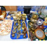 Brass candlesticks and bells, Indian brass vases and ashtrays, a 1940's dressing table set,