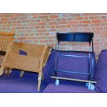 A wicker chair, together with a wrought iron stand raised on castors, 74.5cm high, 59cm wide, 31cm