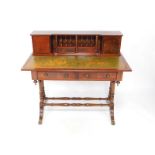 A Shaw of London reproduction mahogany writing table, with green leather insert, the back