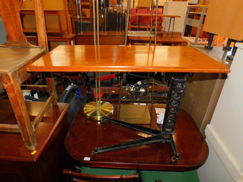 A Victorian cast iron invalid table, with a mahogany top bears label 'Manufactured by Wingygle