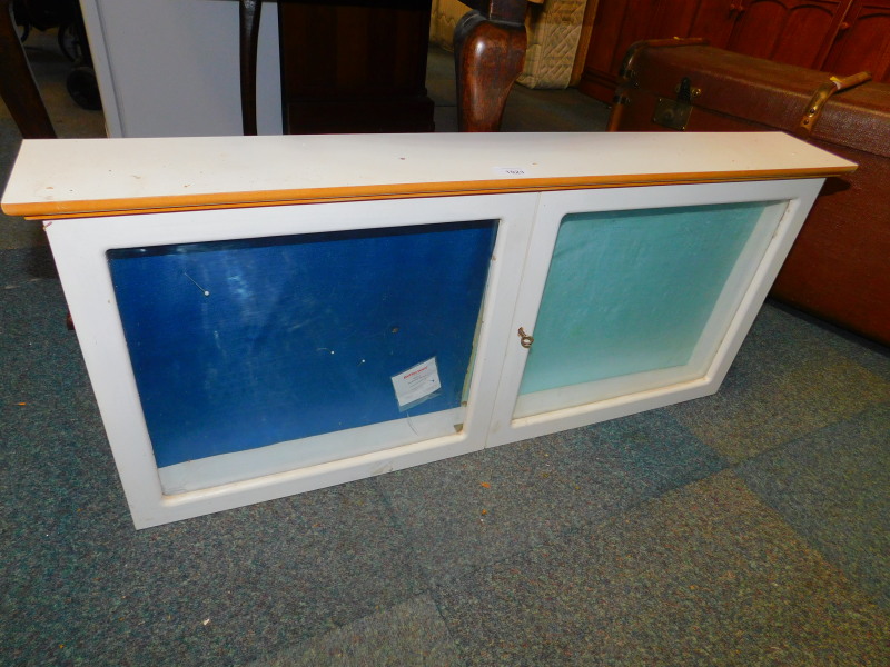A white melamine display cabinet, 43cm high, 96cm wide, 13cm deep.