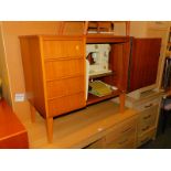 A Bernina sewing machine, enclosed in a teak cabinet, 76cm high, 87cm wide, 45cm deep.