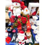Christmas tree ornaments, including a saxophone Santa, Santa music box, animated penguin, together