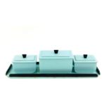 An Art Deco turquoise blue and black Bakelite dressing table set, comprising three boxes on a tray.