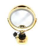 A Revlon brass coated electric vanity mirror.