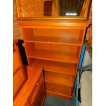 A teak bookcase, enclosing three adjustable shelves, 139cm high, 83cm wide, 32cm deep.